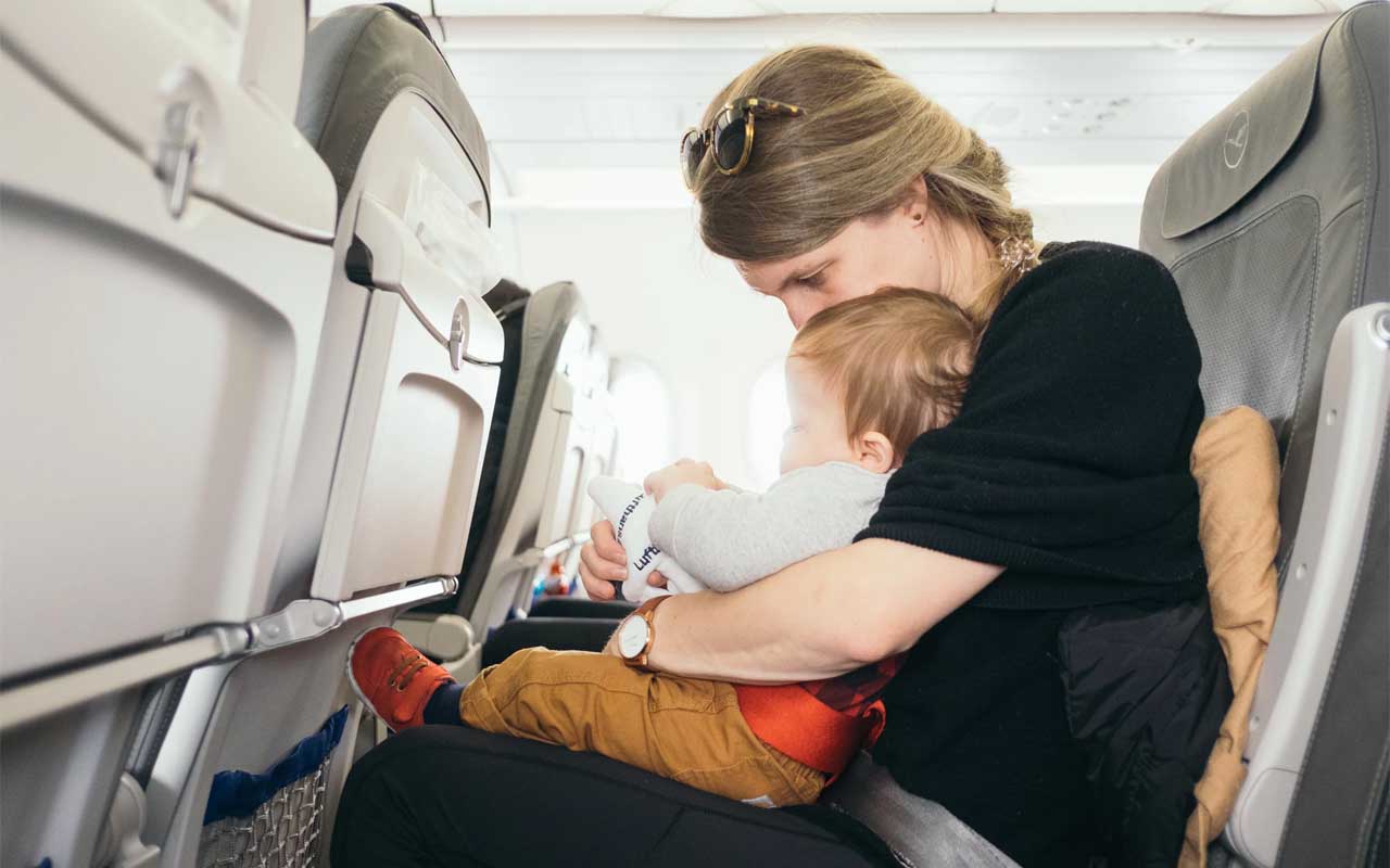 Traveling with a child in lap can be deadly, children, travel, plane, aircraft, flying